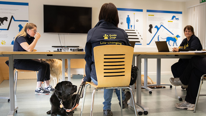 Guide Dogs staff sitting around a table during a training session