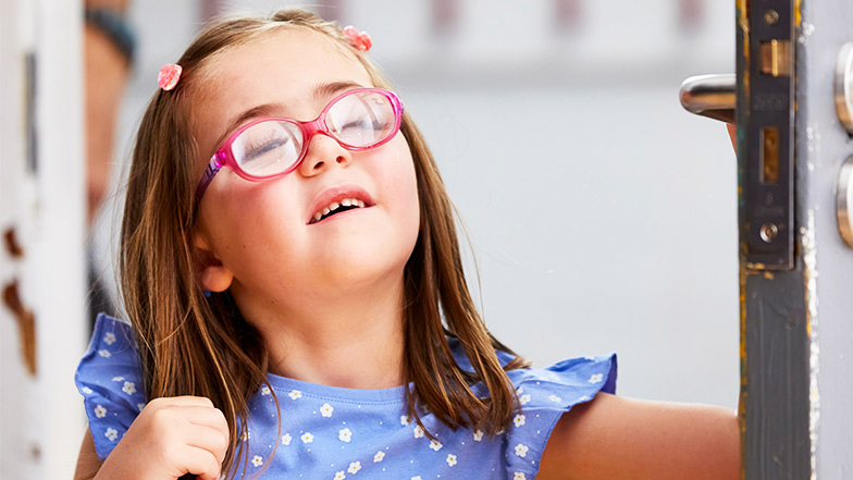Nell smiles as she walks into her classroom