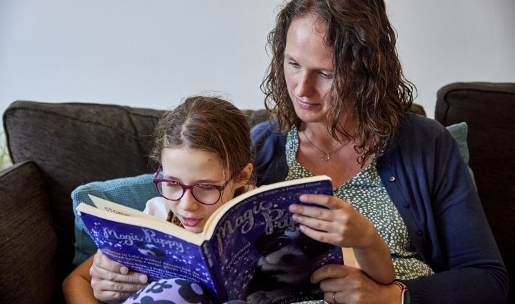 Erin reading with her mother