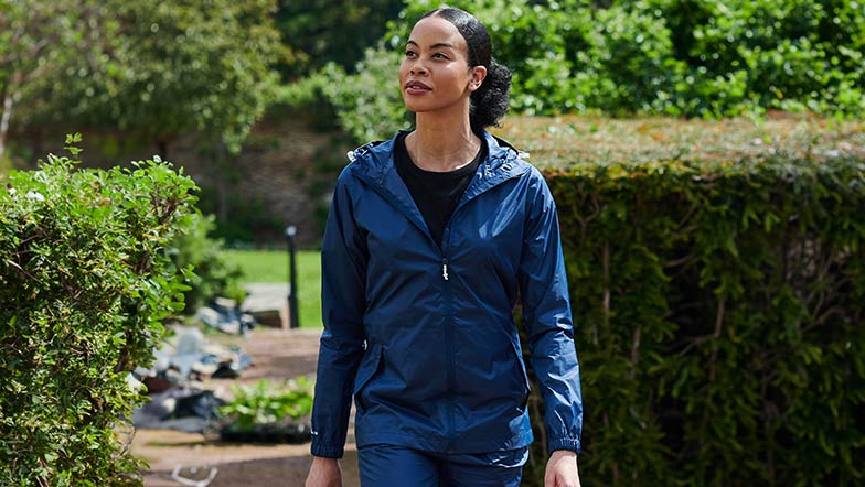 A woman wearing a Regatta Packable jacket, available at the Guide Dogs Shop.
