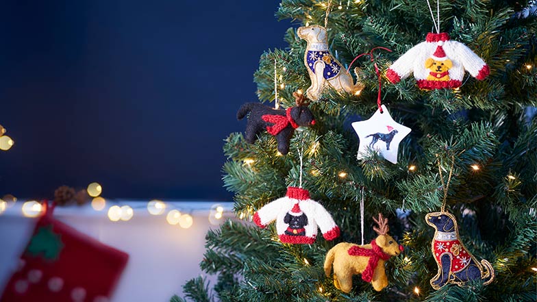 A Christmas tree decorated with Guide Dogs decorations