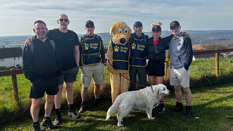 Eclipse Wholesale staff with Guide Dogs mascot, staff and dog