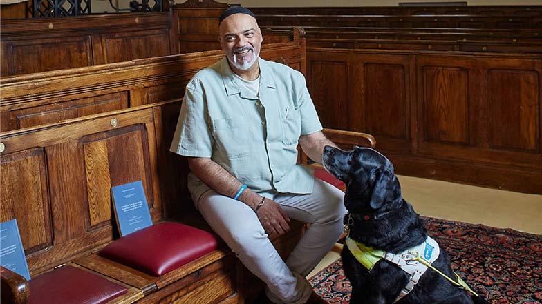 Guide dog owner David and his black lab guide dog Scooby