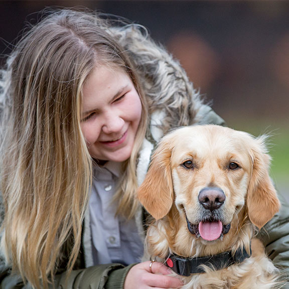 Guide dog owner Milly looking at her guide dog Libby