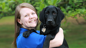 Rach and guide dog puppy in training Yuri