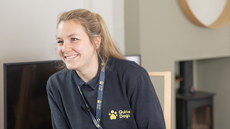 A Guide Dogs member of staff smiling to camera