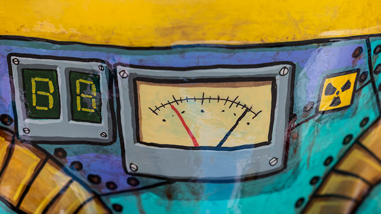 close up of the sculpture's chest showing painted electronic dials and controls