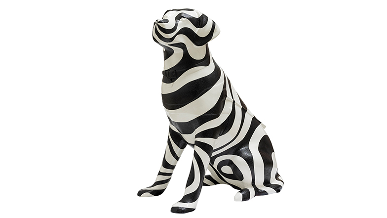 A black and white swirl patterned guide dog sculpture. The black swirl pattern is slightly textured, whereas the white swirls are smooth.