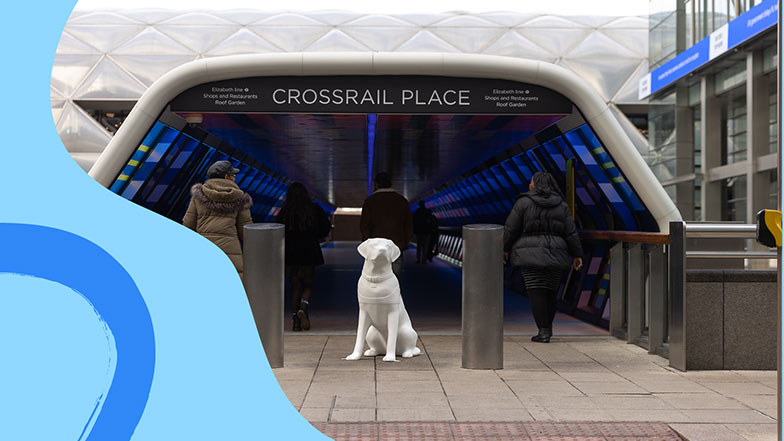 Blank white guide dog sculpture sitting at the entrance of Crossrail Place in Canary Wharf.