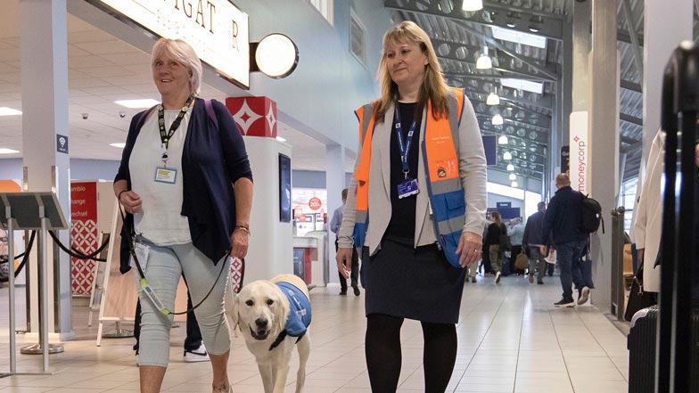 Jacki and Spirit walking through the airport Jacki and Spirit walking through the airport