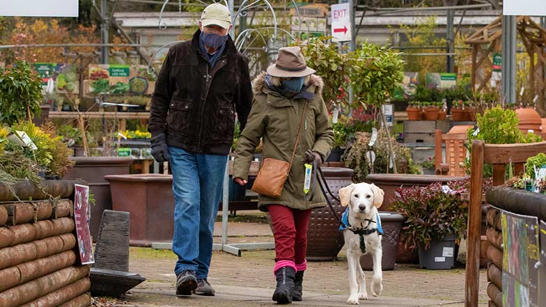 Willow and her Puppy Raisers at a garden centre