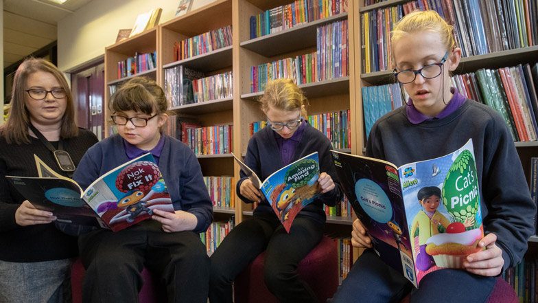 Two boys reading Guide Dogs' CustomEyes Books