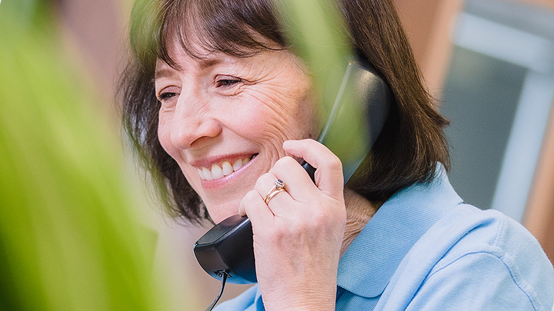 Guide Dogs Family Support Officer on the phone