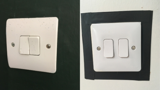 White light switch against a dark green painted wall and a white light switch on a white wall with the switch edged with black tape to help contrast 