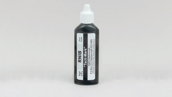 Image of a bottle of black Tacti-mark