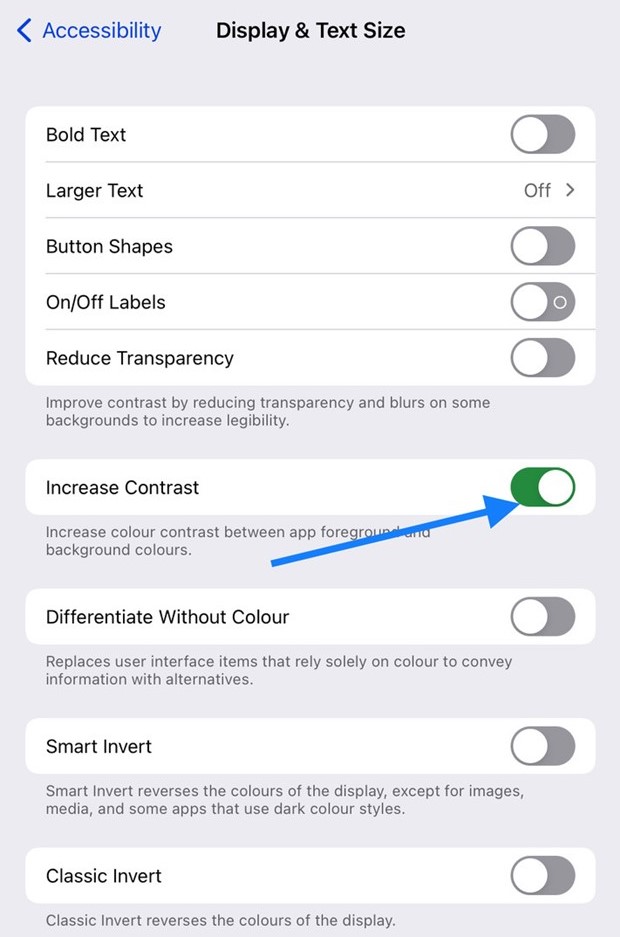An iPhone screen with an arrow pointing to the "Increase Contrast" option within "Display & Text Size" under the accessibility menu