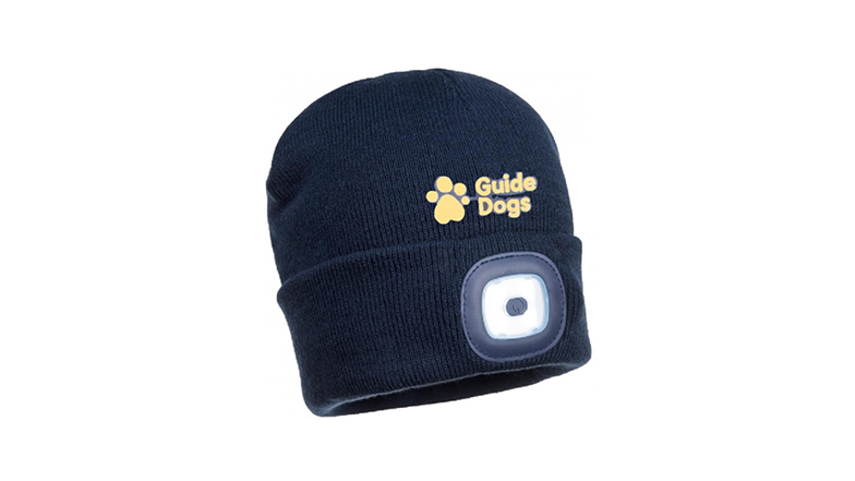 A navy knitted beanie style hat that features an LED headtorch and a yellow people paw logo
