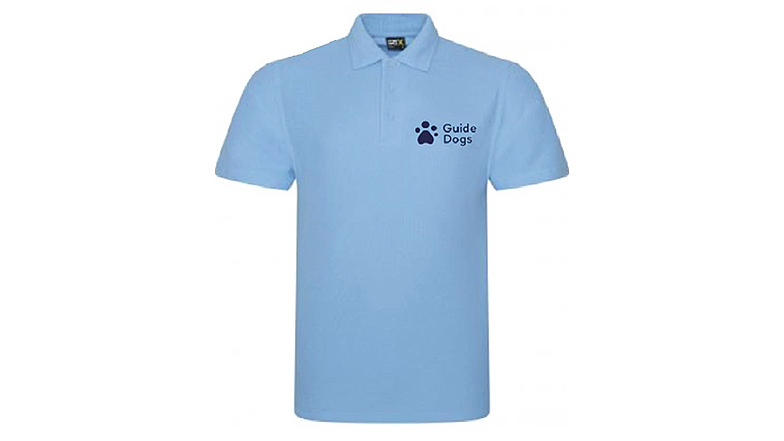 A polo-shirt in pale sky blue with a navy blue people paw logo and “Guide Dogs” wording on the left hand side of the chest.