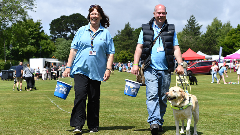 Guide dogs volunteer collecting donations